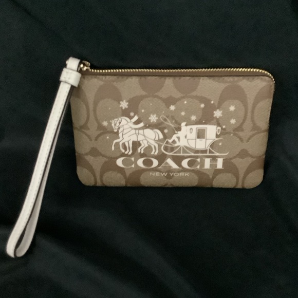 Coach Handbags - Coach Brown Signature Canvas Wristlet with Winter Scene Coach Graphic and Strap